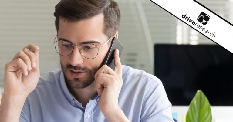 Male with glasses talking on cell phone