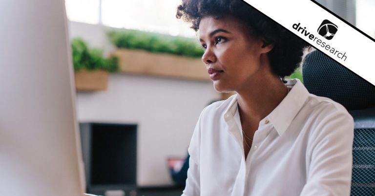 Woman looking at computer programming a survey