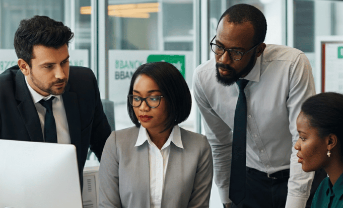 Banking workers at computer