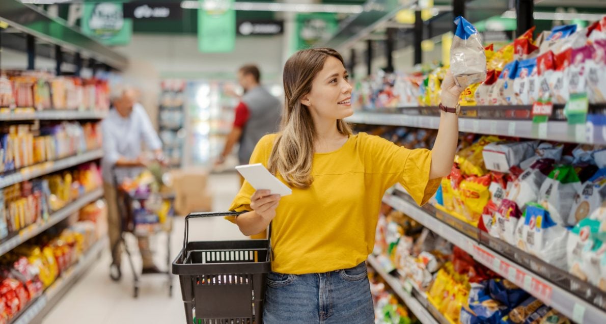 Woman shopping for consumer goods at grocery store