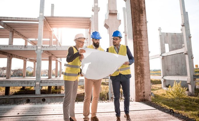 Construction workers discussing plans