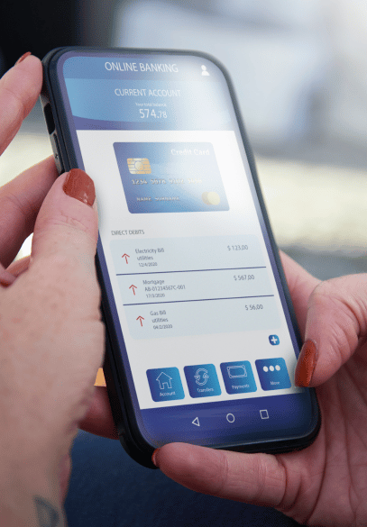 Hands holding phone with online bank on screen