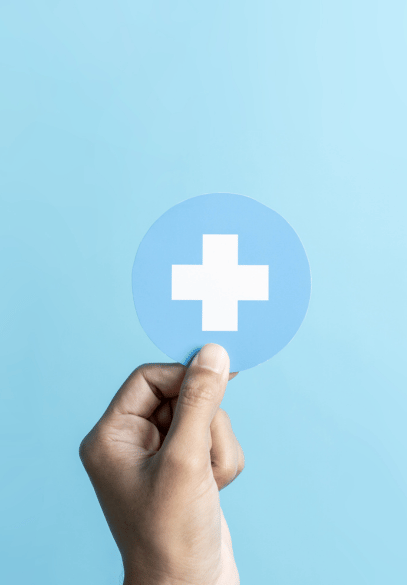 Healthcare service concept - hand holding blue healthcare symbol