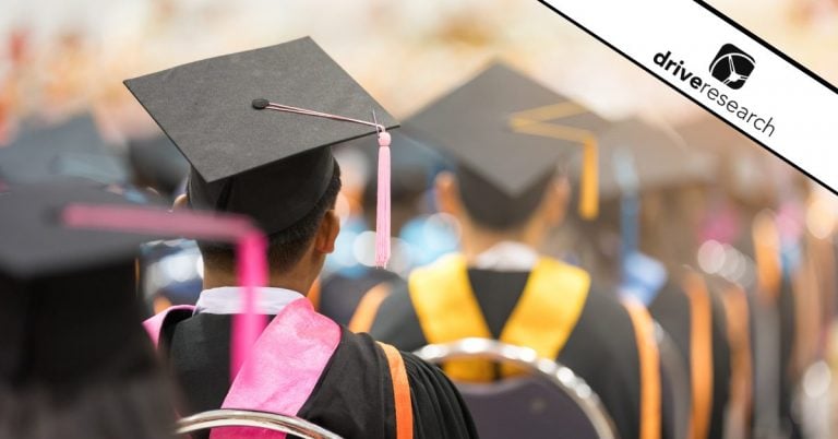 College students sitting at graduation