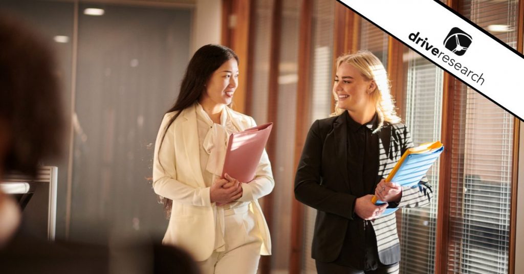 Two female lawyers walk in office