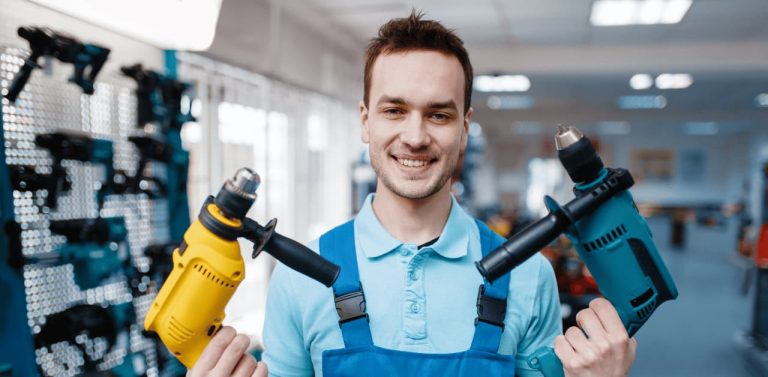 Man holding two power tools