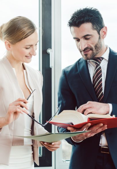 Two lawyers talking in office