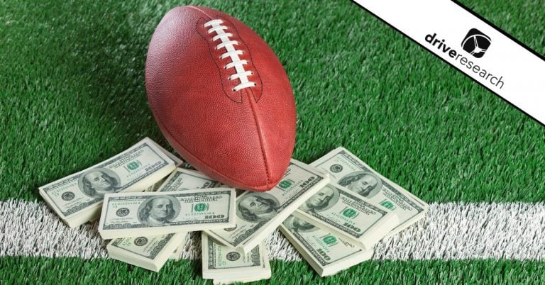 Football and cash on football field