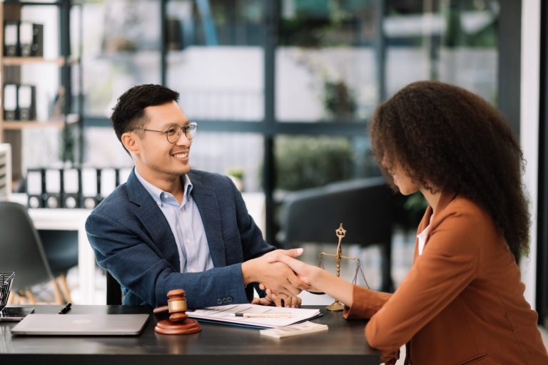 Business team and lawyers discussing contract papers