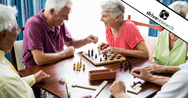 Seniors playing chess in common area