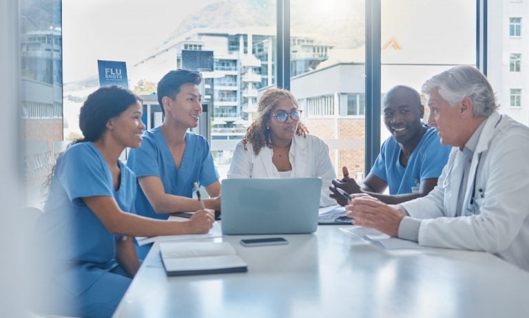 Cropped shot of a group a medical professionals sitting in the hospital boardroom during a meeting