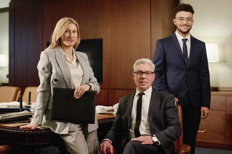 Group of Experienced Attorneys Posing in Conference Room