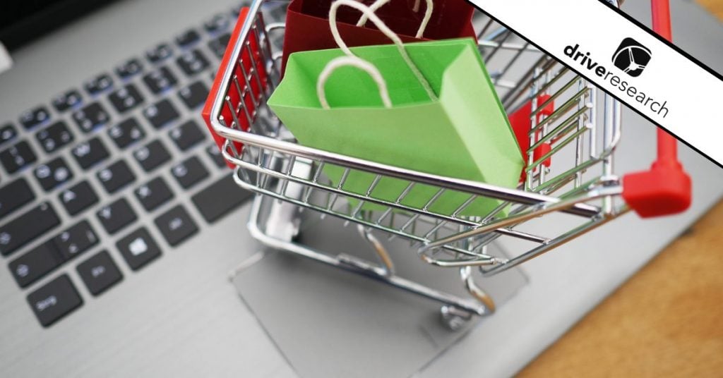 Shopping cart figurine on laptop