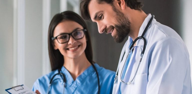 Doctor and nurse signing paper