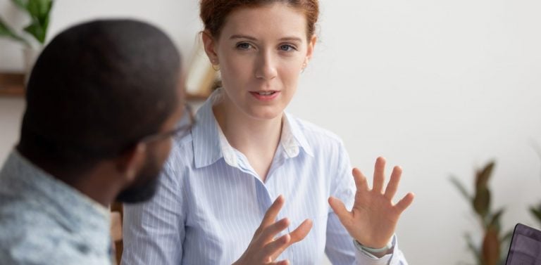 Employees talking in office