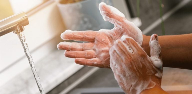 Hygiene. Cleaning Hands. Washing Hands with Soap in the Kitchen