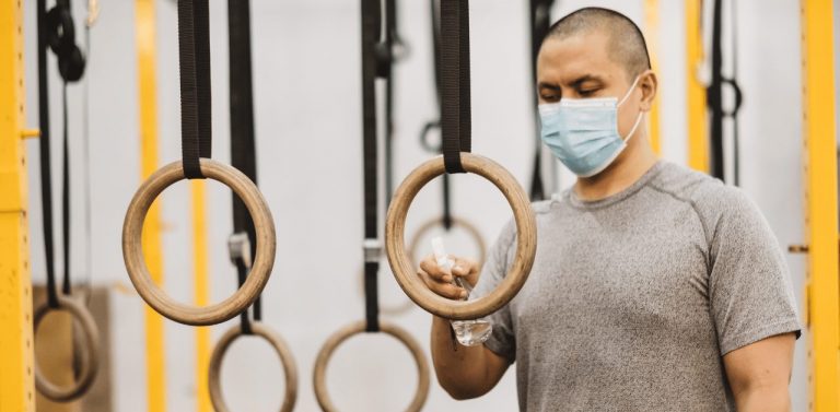 Male in gym with mask on