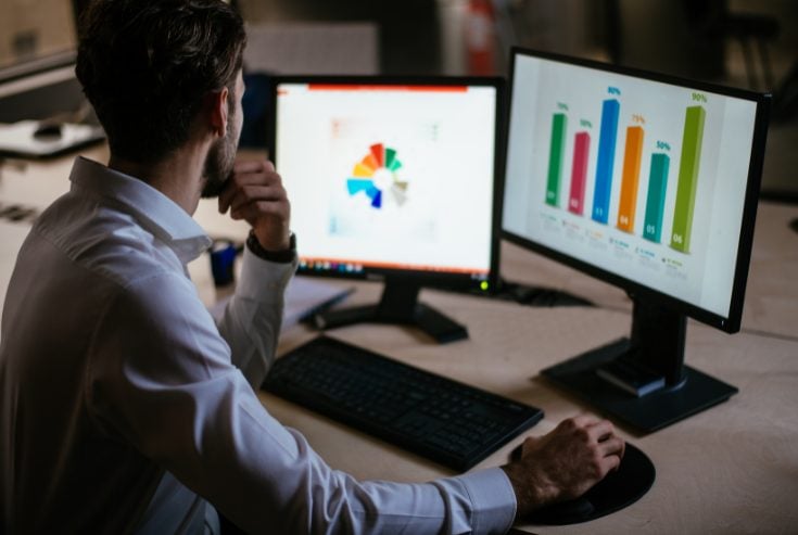 Man doing market research on computer