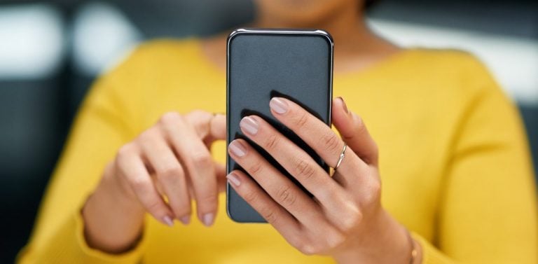 Woman scrolling on smartphone