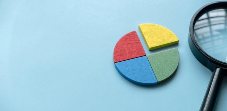 Colorful pie chart with magnifying glass