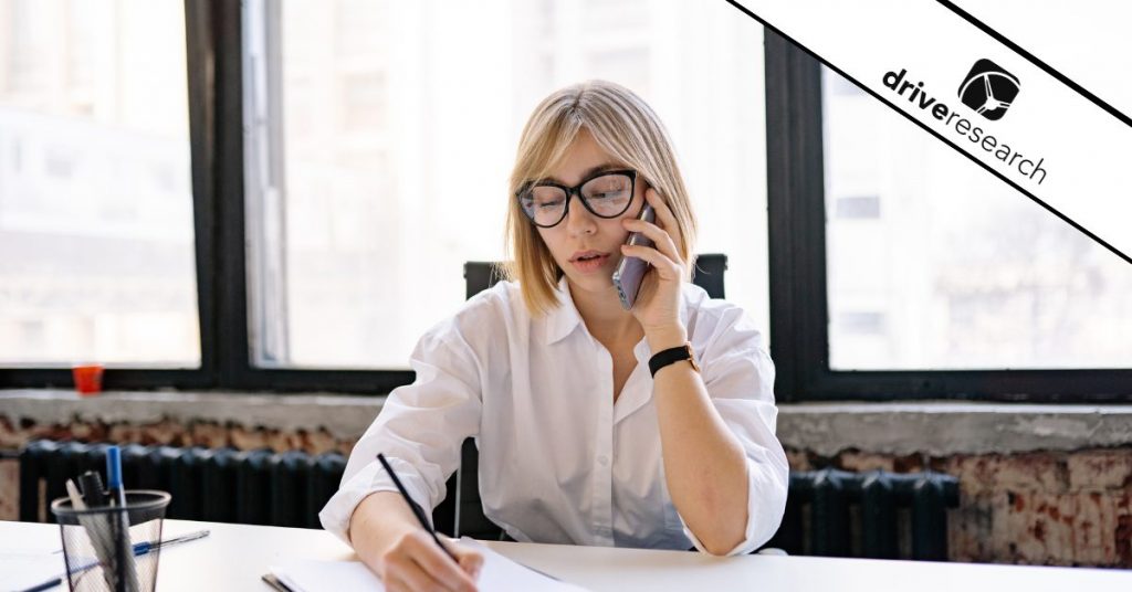 Woman talking on phone in office